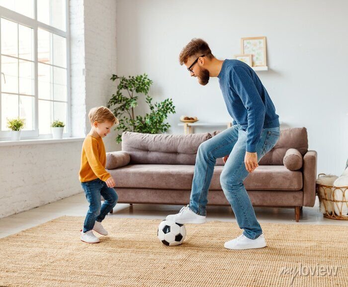 Kid playing in home with father